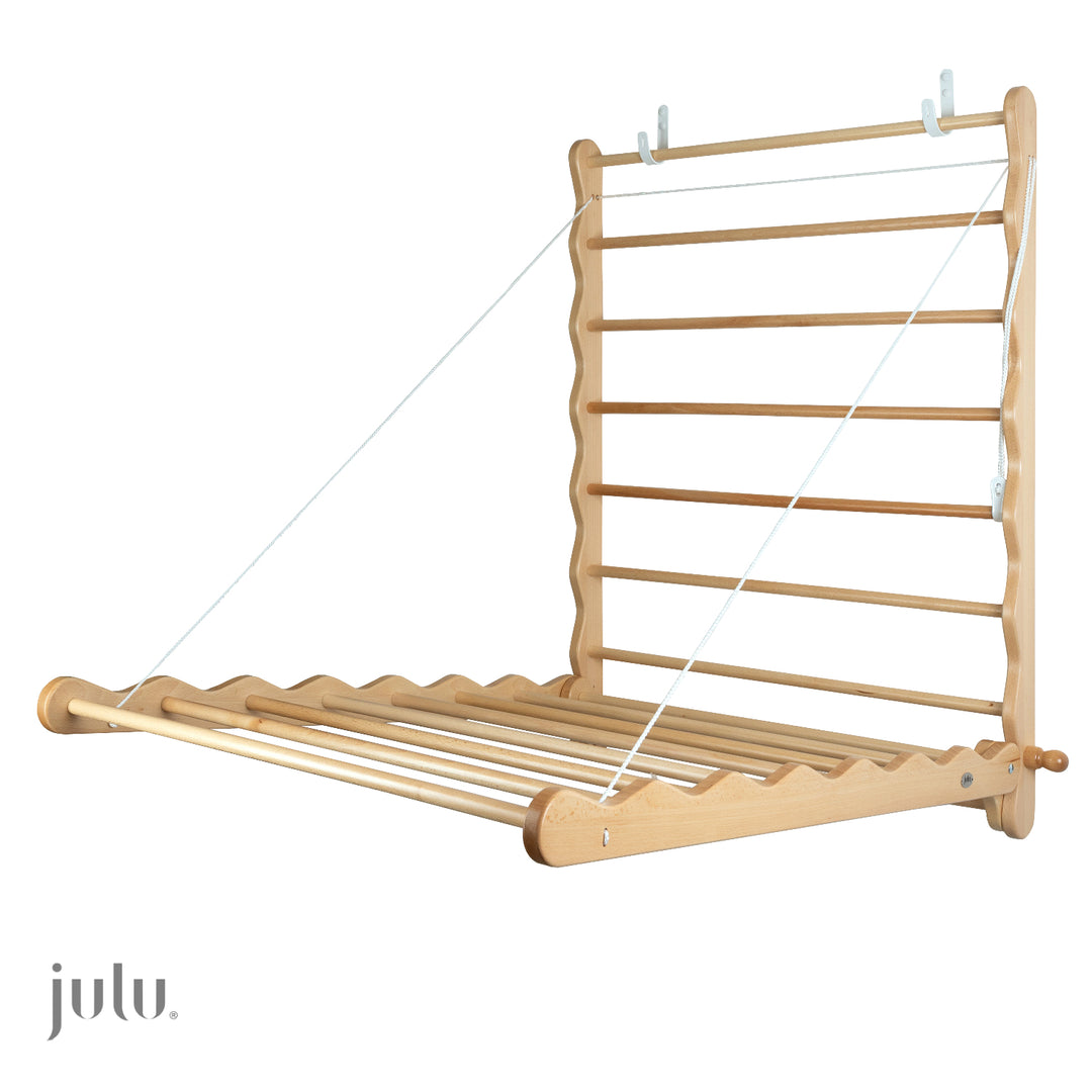 Quality Wooden Beech Clothes Airer, drying rack. extended fully on a wall.