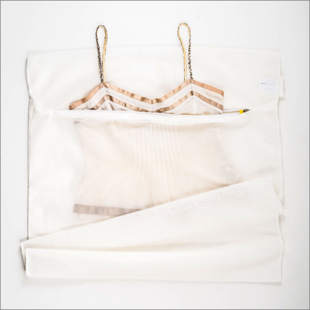 Large net bag for your washing machine.  Keep your clothes together and stop from getting caught up with other items.