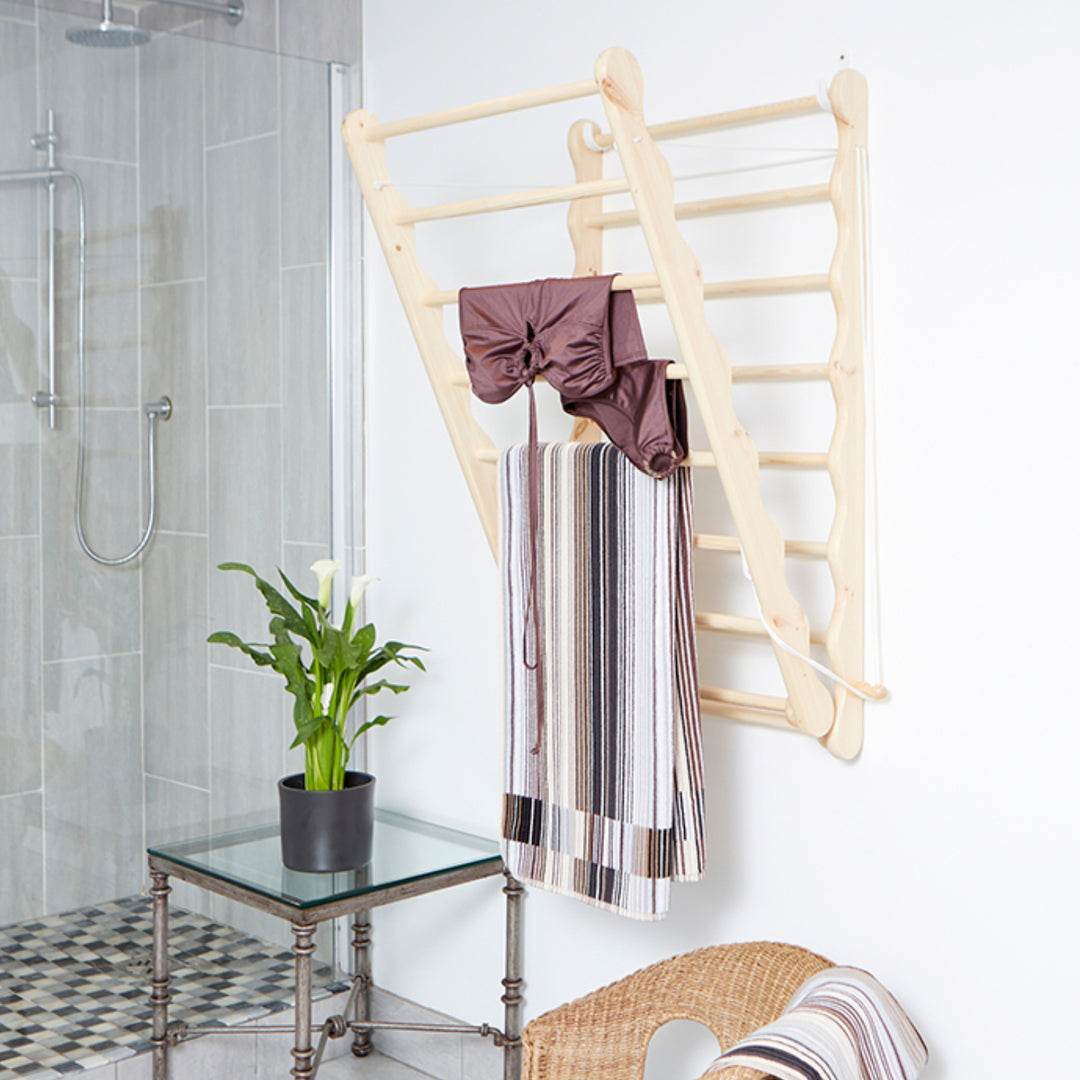 Elegant Wooden Pine Clothes Airer, being used in a bathroom From Julu