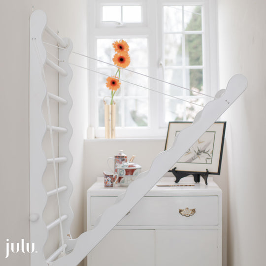 Painted White Wooden Drying Rack, shown on a landing From Julu
