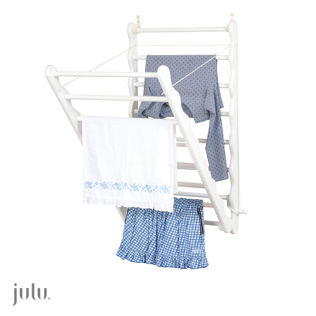 Image shows wall mounted clothes airer open with clothes drying by Julu