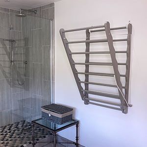 Image of Julu Bunty wall mounted clothes drying rack in grey in bathroom